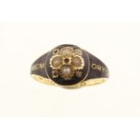 A Victorian 18ct mourning ring set with seed pearls, H/M Birmingham 1875 & inscription dated 1876,