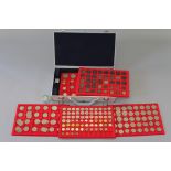 An Aluminium case containing five trays of mainly 20th century half-crowns, florins & shillings,