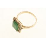 A modern emerald & diamond square set cluster ring stamped 18k, approx 0.50cts of diamonds & 4.