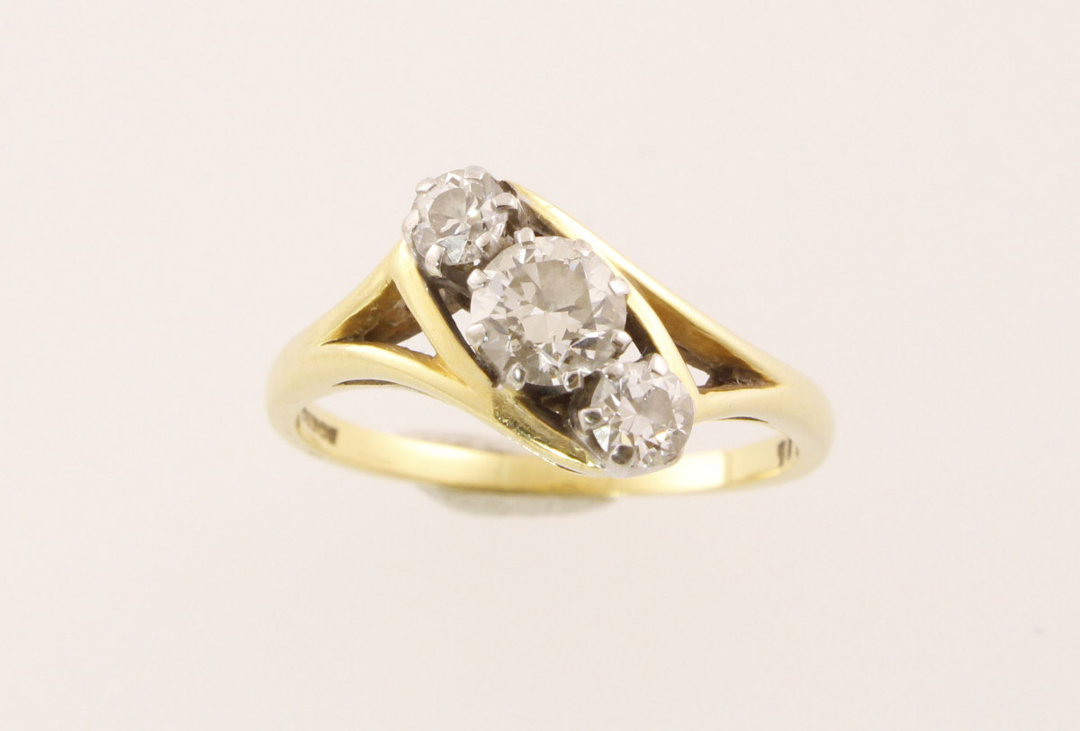 An 18ct three stone diamond ring totalling approx 0.80cts & 3.