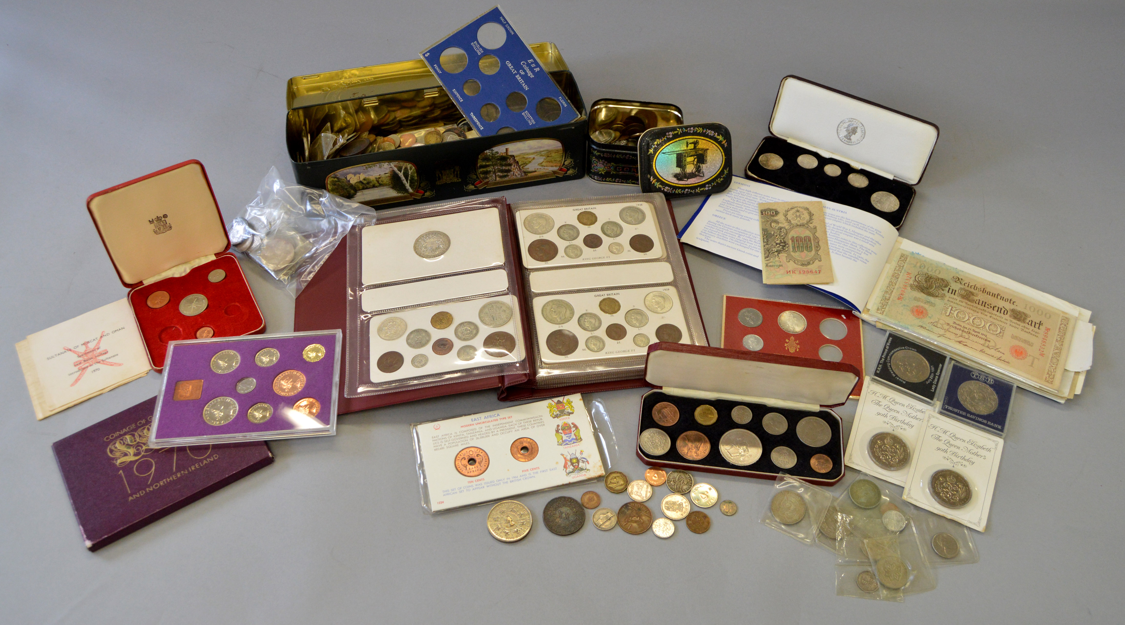 A boxed quantity of assorted coins including Victorian double florins, Georgian half-crowns,