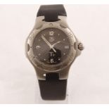A steel TAG quartz wristwatch with fitted rubber strap, model WL1181/ZJ3177,