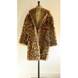 1950s Beaver lamb leopard print fur coat. Pockets and a back self-facing belt.