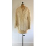 1970s white rabbit fur ladies coat with lapel collar and hook and eye front fastening.