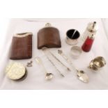 A small boxed quantity to include silver sugar tongs, two spoons, small cream jug,