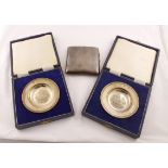 Two cased silver 'Armada' dishes with embossed ship decoration, each approx 36gms H/M London 1969,