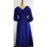 1940s evening gown in royal blue silk chiffon. Beaded neckline and low back detail with bow.