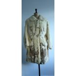 1960s Rabbit fur coat. 3/4 length with back belt and front pockets.