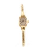 A 9ct H/M TUDOR 1950's ladies wristwatch with fitted 9ct bracelet stamped ROLEX,