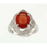 An 18ct white gold ruby (treated) & diamond ring, the central stone approx 3ct, weight approx 6.