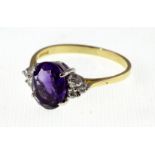 An 18ct H/M oval Amethyst & Diamond cluster ring, approx 4.