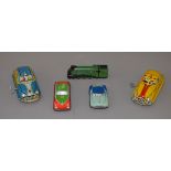 A mixed lot of unboxed tinplate toys including a Marx Yellow Cab and a 'Woody Wagon',