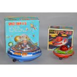 Two boxed battery operated spaceship toys of tinplate and plastic construction,