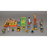 Four boxed tinplate and plastic mechanical novelty toys of Chinese origin,