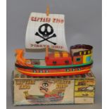 A boxed battery operated Japanese tinplate and plastic 'Captain Kidd Pirate Ship' by Yonezawa.