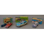 Three boxed toy cars of tinplate and plastic construction, a large Chinese friction 'Racing Car',