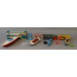 Four boxed model boats of plastic and tinplate construction by various British manufacturers