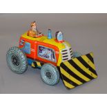 An unboxed Technofix tinplate clockwork Tractor with Shovel,