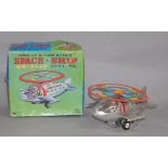 A boxed Japanese tinplate clockwork Space Ship with 'Wind-up U-turn action'.