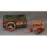 A boxed tinplate and plastic Cragstan battery operated wired remote control model of a Ford