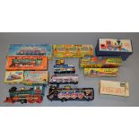 Nine boxed railway related toys of tinplate and plastic construction,