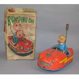 A boxed tinplate battery operated ' 5 Action Bumping Car' by Alps (Japan).