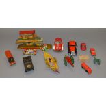 A small quantity of unboxed tinplate and plastic toys, some with damage,