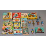 Thirteen boxed tinplate motorcycle and other models including friction drive and clockwork examples.