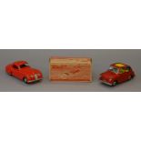 A small group of tinplate toys including a Distler Jaguar XK140 and a Bandai Fiat 600,