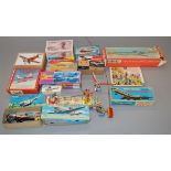 A quantity of tinplate aircraft and helicopter models including friction drive and clockwork