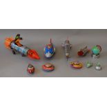 Ten unboxed tinplate and plastic space related toys in a variety of different scales,