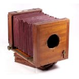 Wood and brass whole plate tailboard camera by E Marlow, Birmingham with maroon square-cut bellows,