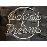 A "Cocktails & Dreams" electric 'neon' sign