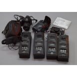 Four large walkie-talkies together with a Nikon TW 200 camera and a Fuji S6500 FD digital camera