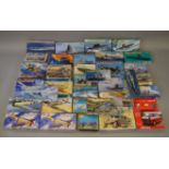 Thirty four model kits, in a variety of different scales, by Academy, Italeri,