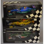 Three boxed Minichamps 1:18 scale diecast model F1 Racing Cars including Jaguar Racing R5 'C.