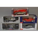 Five boxed 1:18 scale diecast model cars by Mondo Motors and Greenlight,