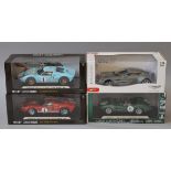 Four boxed 1:18 scale diecast model cars by Mondo Motors and Shelby Collectibles,