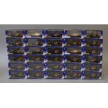 Thirty boxed Corgi Lotus F1 Team racing cars in 1:43 scale, some being duplicates.