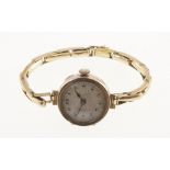 A 9ct ladies wristwatch with working mechanical movement & expandable bracelet stamped 9ct,