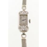 A diamond set BENSON cocktail watch, the case marked PLATINUM with fitted mesh bracelet marked 9ct,