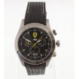 A gents stainless steel FERRARI quartz wristwatch with cronograph function & fitted leather strap,