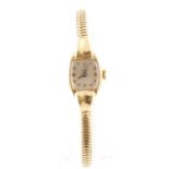 A 9ct H/M TUDOR 1950's ladies wristwatch with fitted 9ct bracelet stamped ROLEX,