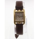 A ladies 18ct HERMES wristwatch with stirrup shaped case & fitted original long leather strap,
