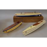 A boxed wooden Kellner clockwork model boat, approximately 54cm long in F box,