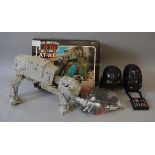 A mixed lot of toys including a boxed Star Wars At-At,