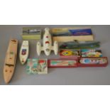 A small group of unboxed model boats including a Sutcliffe Bluebird II,