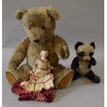 A vintage musical soft toy Panda together with a large Teddy Bear,