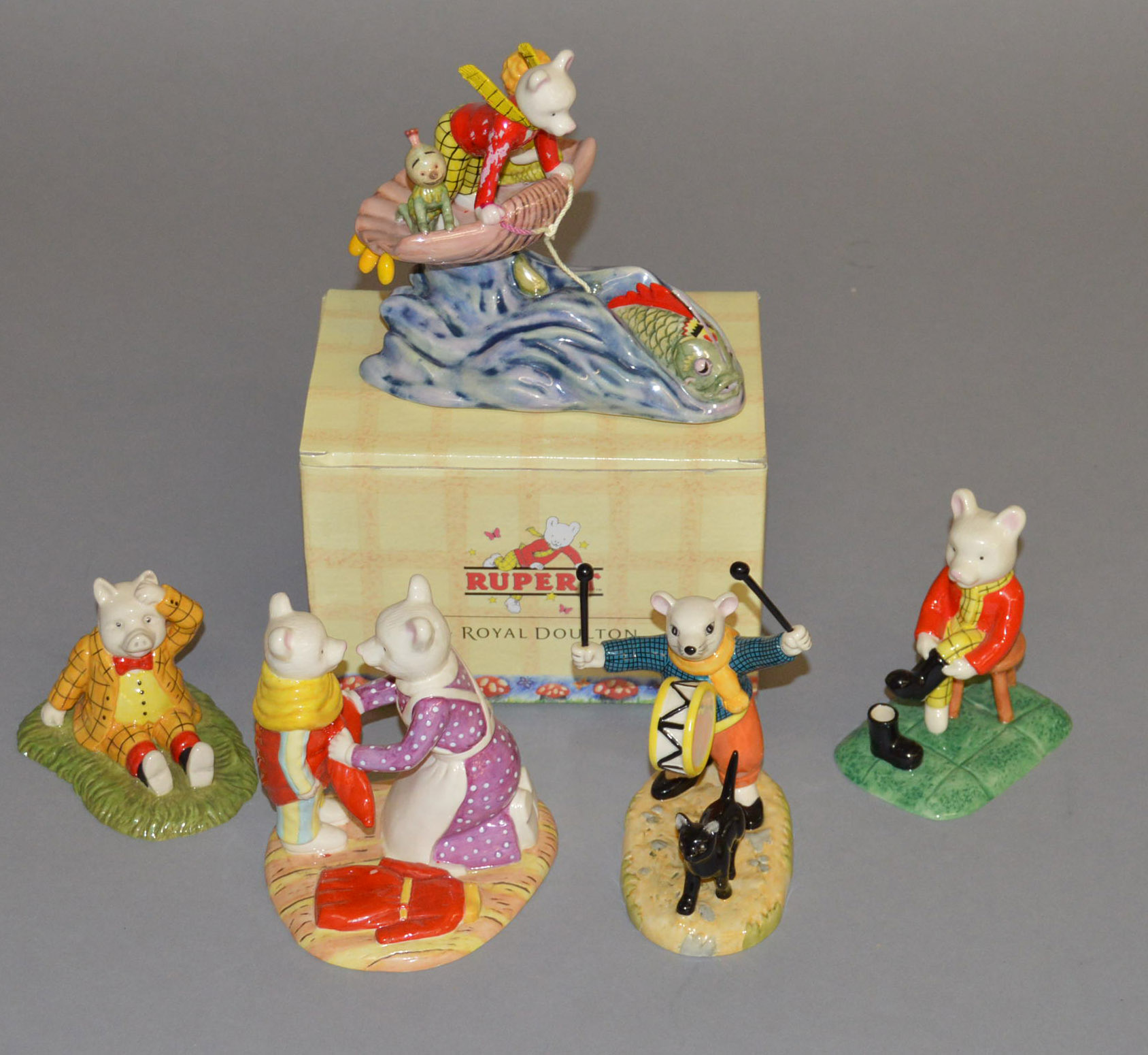 5 Royal Doulton Rupert figures: Out For The Day RB 14, Banging On His Drum RB 17,