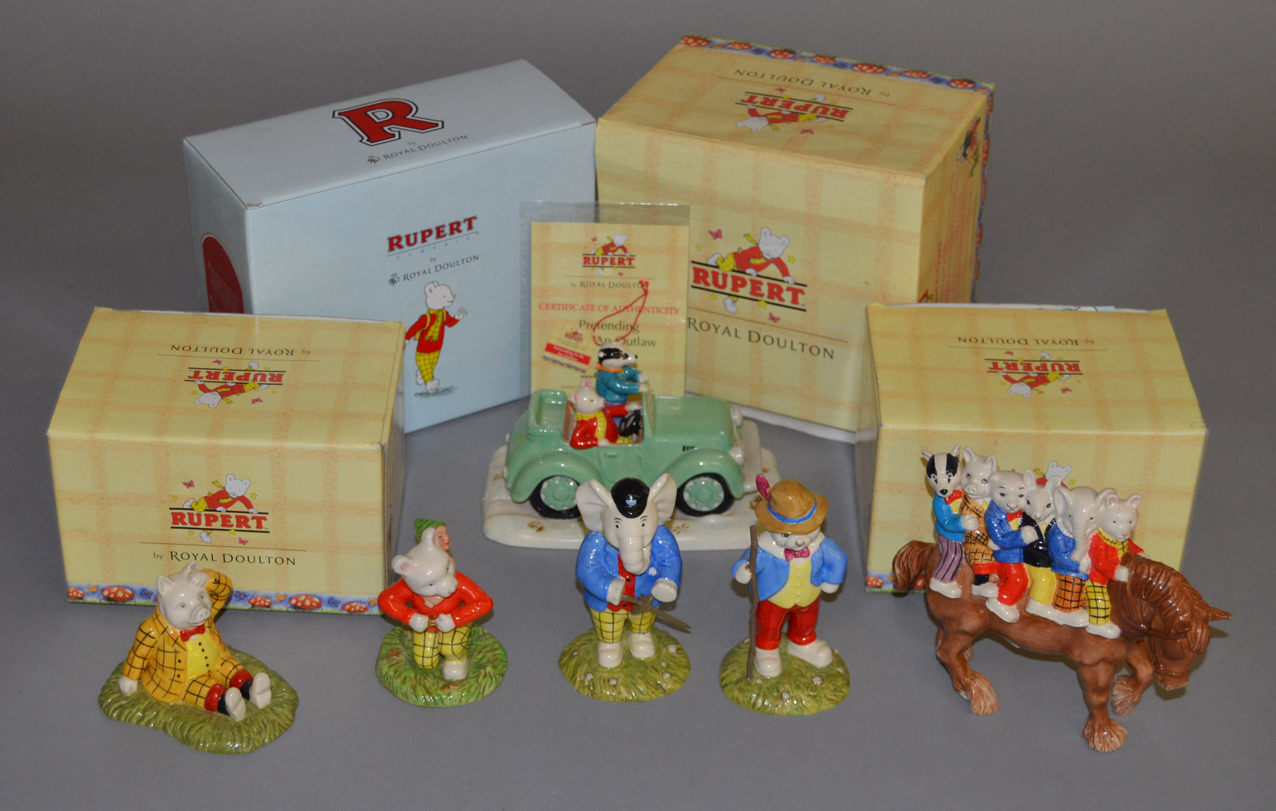 6 Royal Doulton Rupert figures: Hitching A Ride RB 36 0366/450, Pretending To Be An Outlaw RB 2,